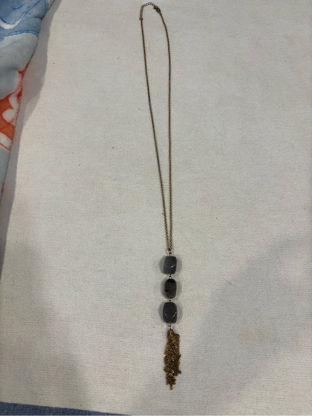 Gold Tone Chain Necklace with Gray Stone Beads and Tassel